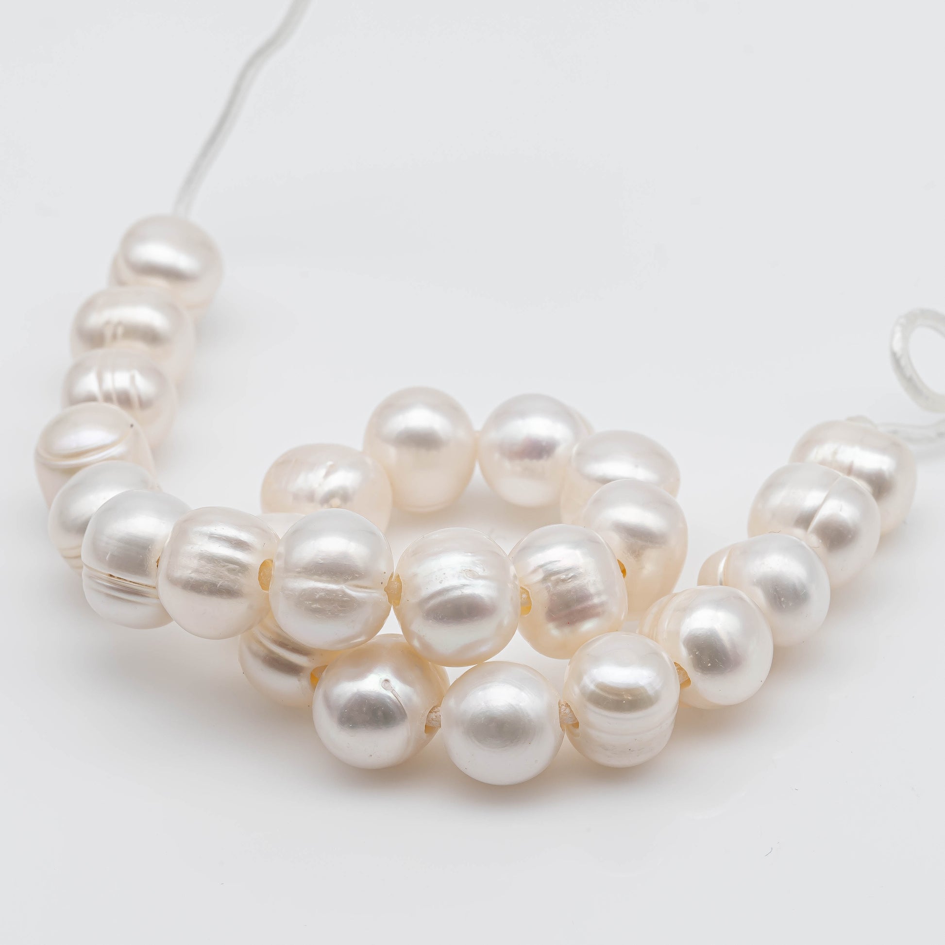 Single strand of large hole Freshwater Pearl.