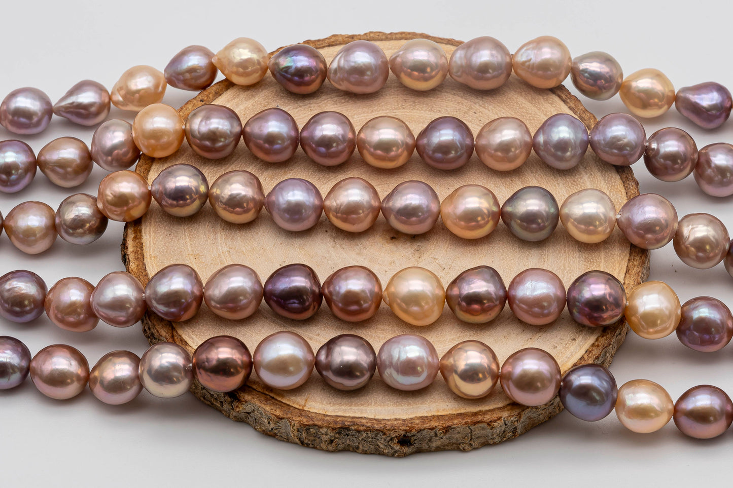 Edison Pearl Mult Color Strands on top of a wood.