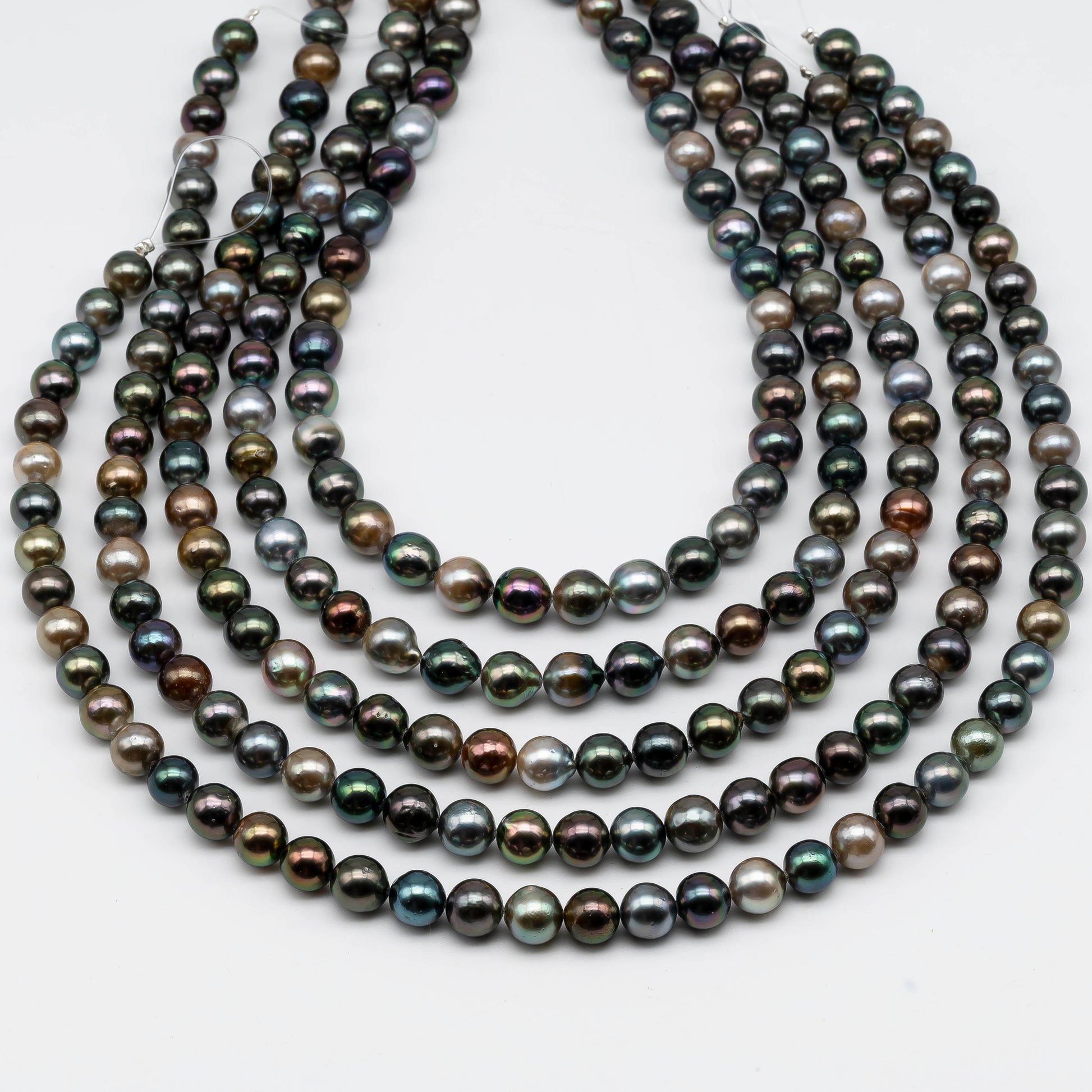 Multiple strands of Tahitian Pearl in natural multi colors.