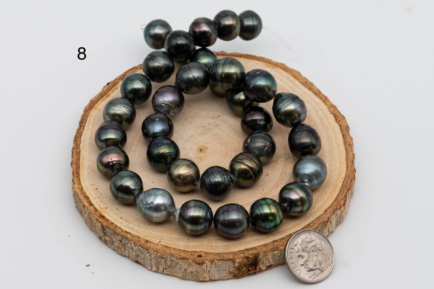 Displaying item number 8, Tahitian Pearl near round in full strand.