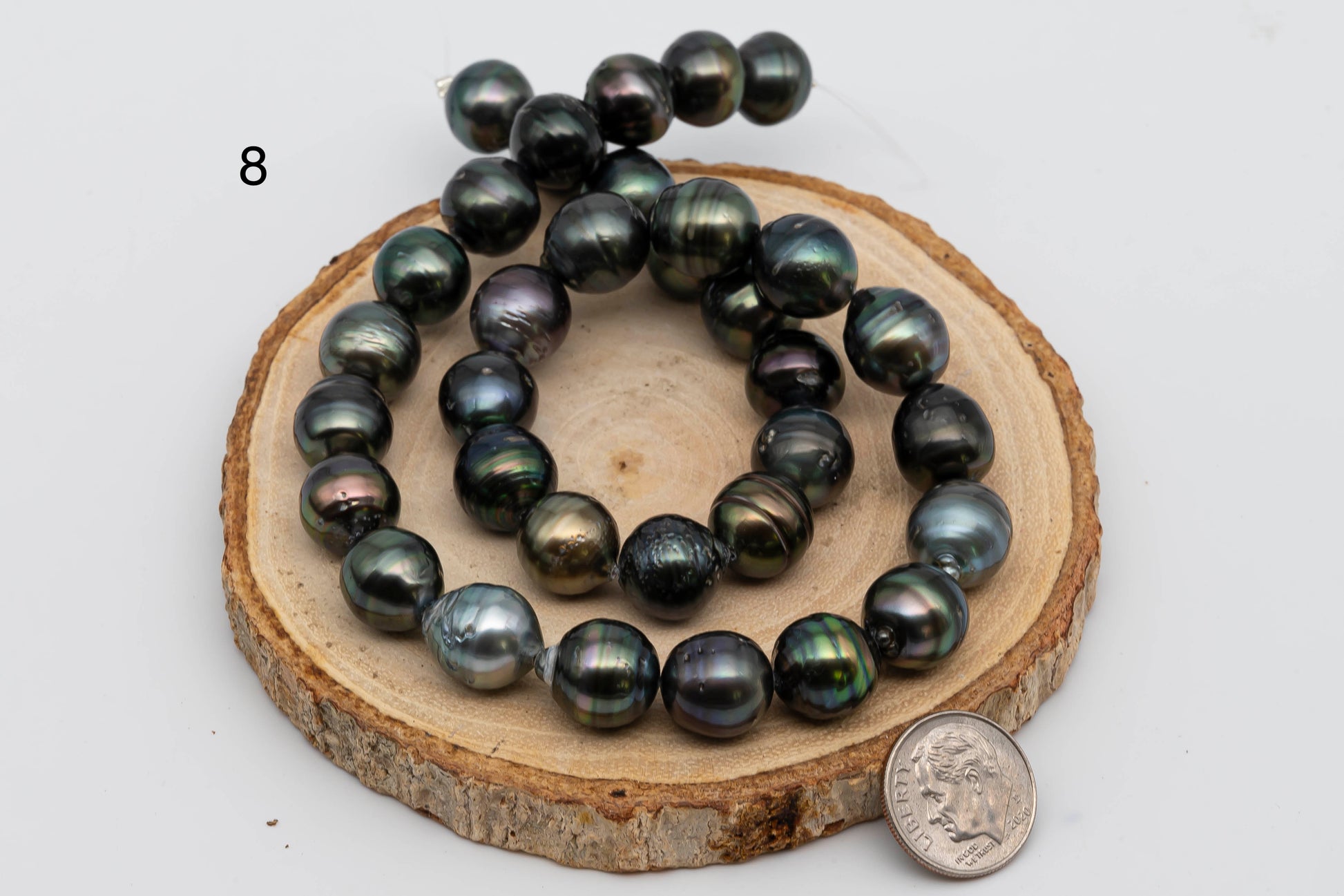 Displaying item number 8, Tahitian Pearl near round in full strand.