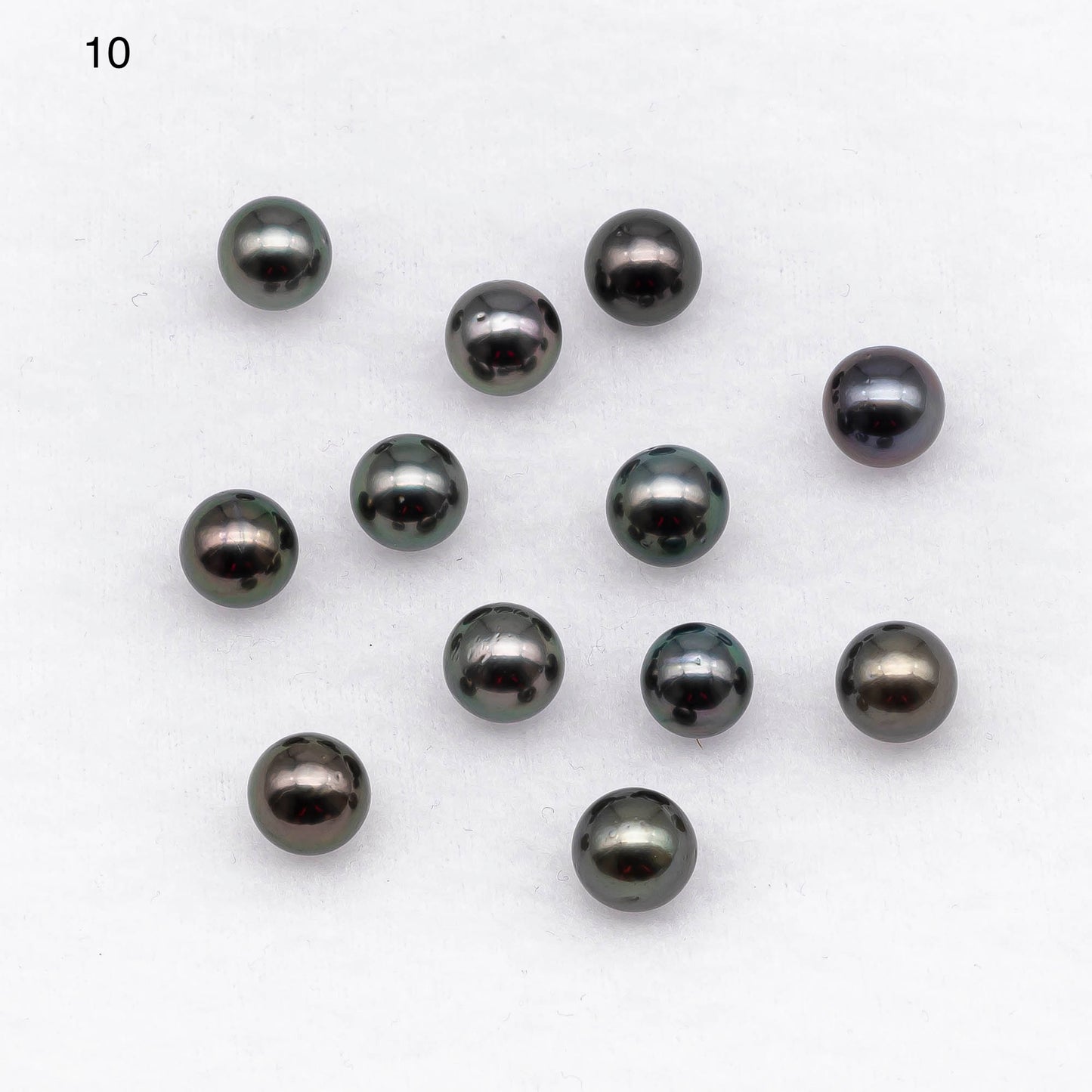 Tahitian Pearl loose round shape in blue or green colors with lesser blemishes