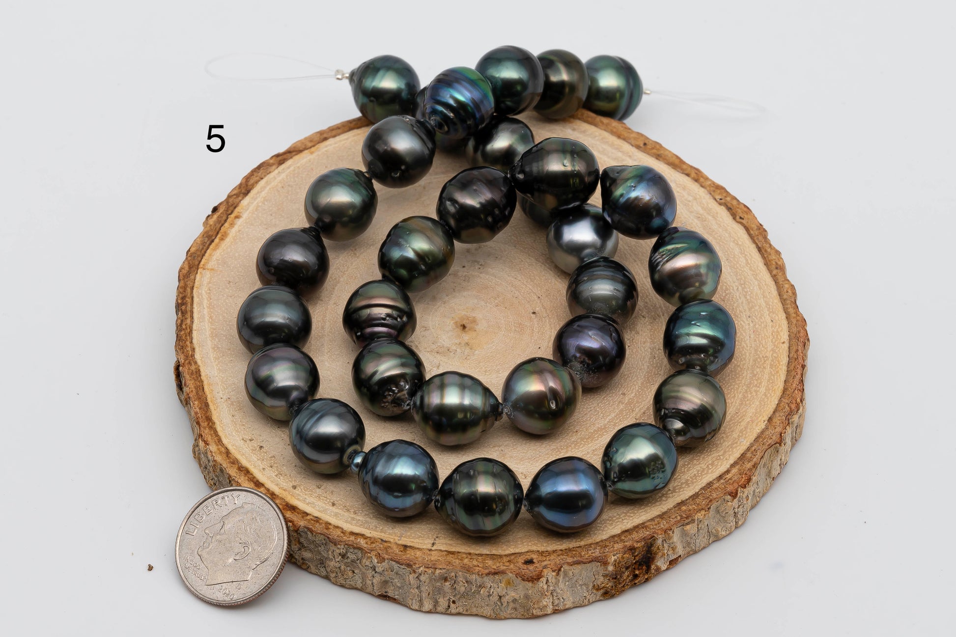 Displaying item number 5, Tahitian Pearl near round in full strand.