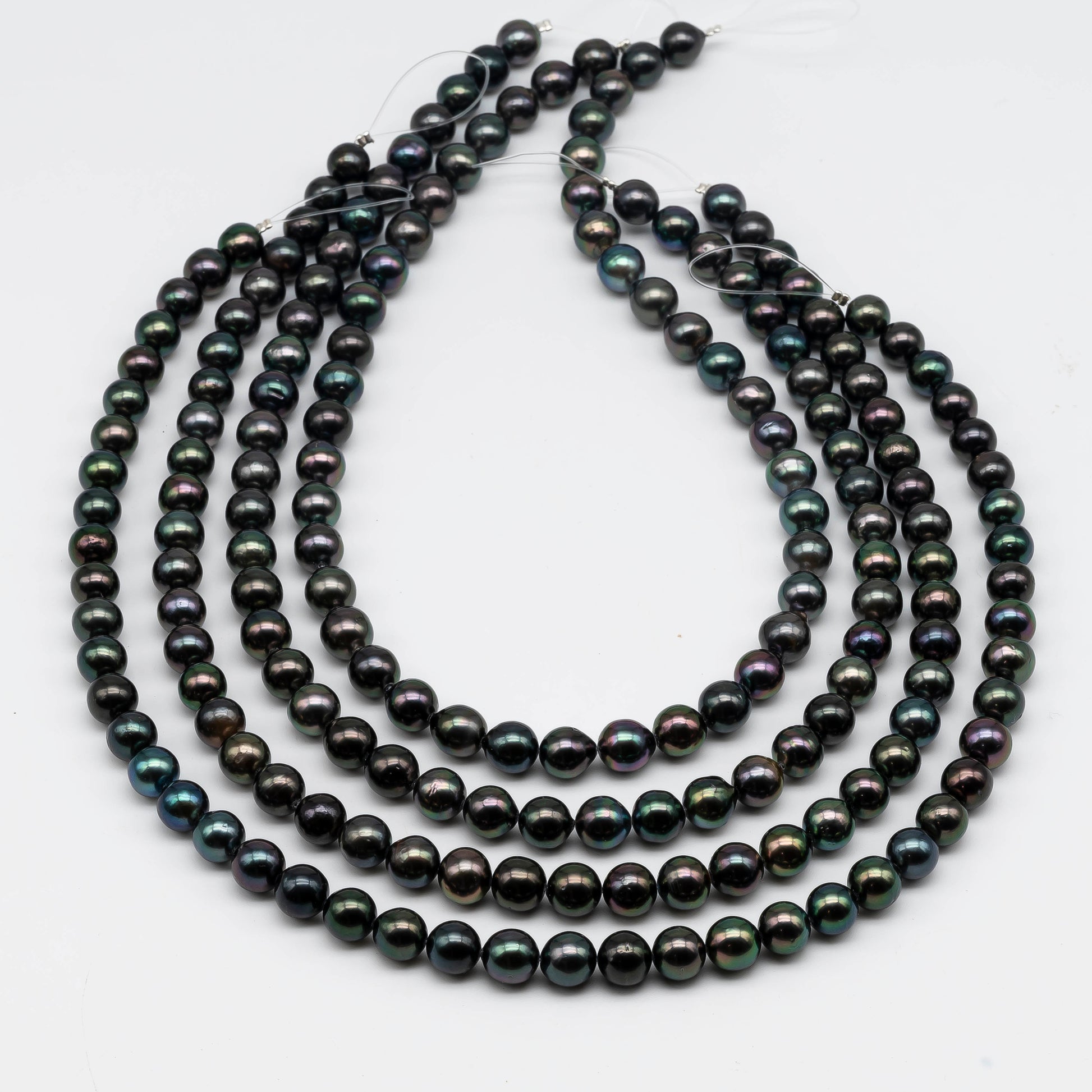 Multiple strands of Tahitian Pearl in peacock color.