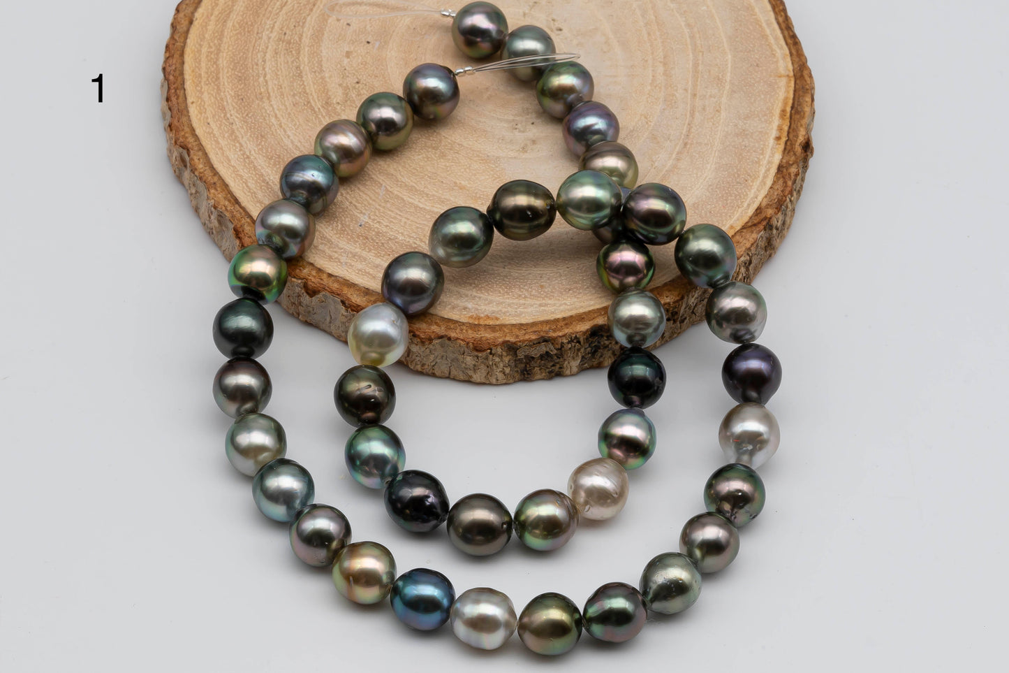 1st strand of Tahitian Pearl Multi color Near Round.