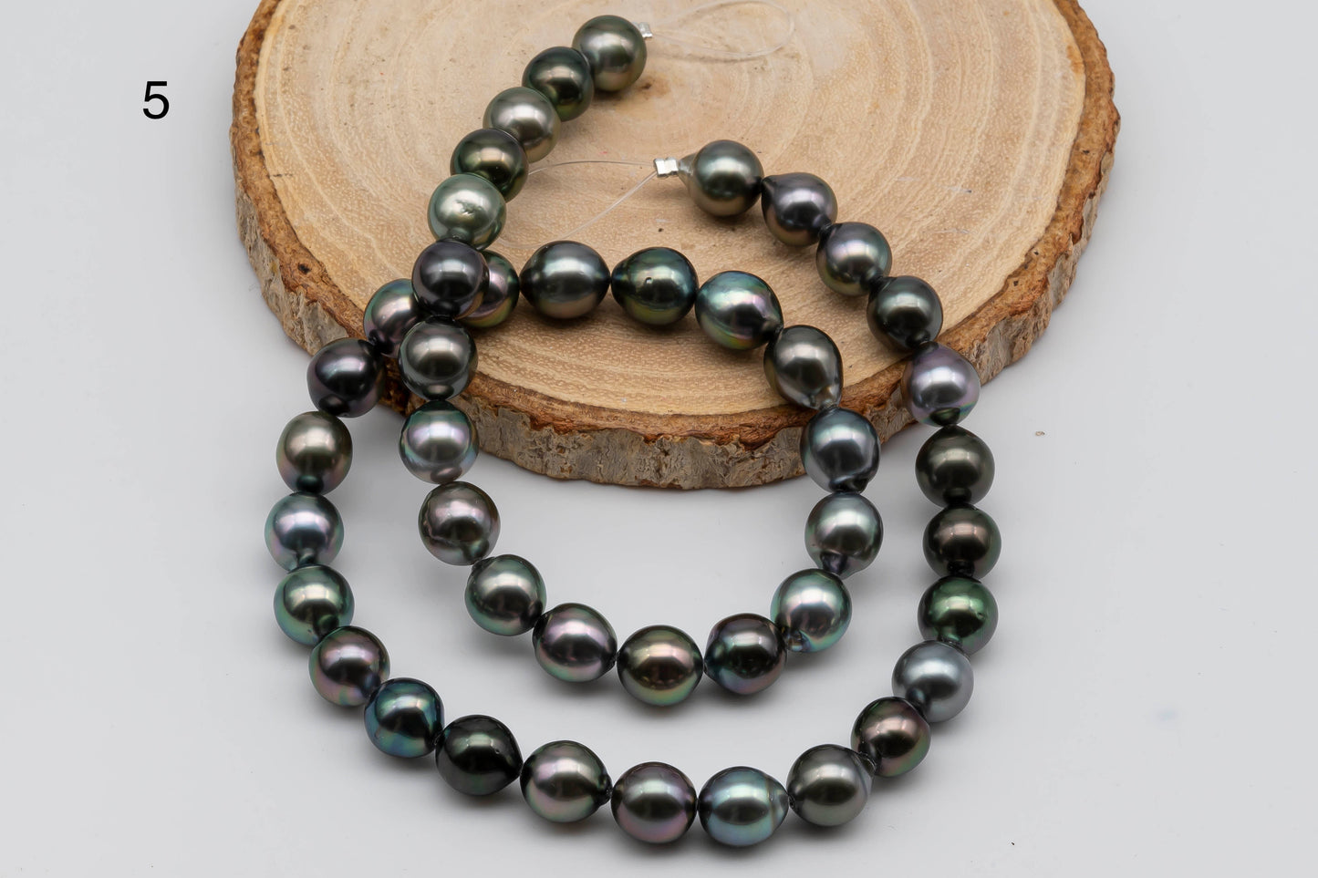 5th strand of near round multi color Tahitian Pearl.
