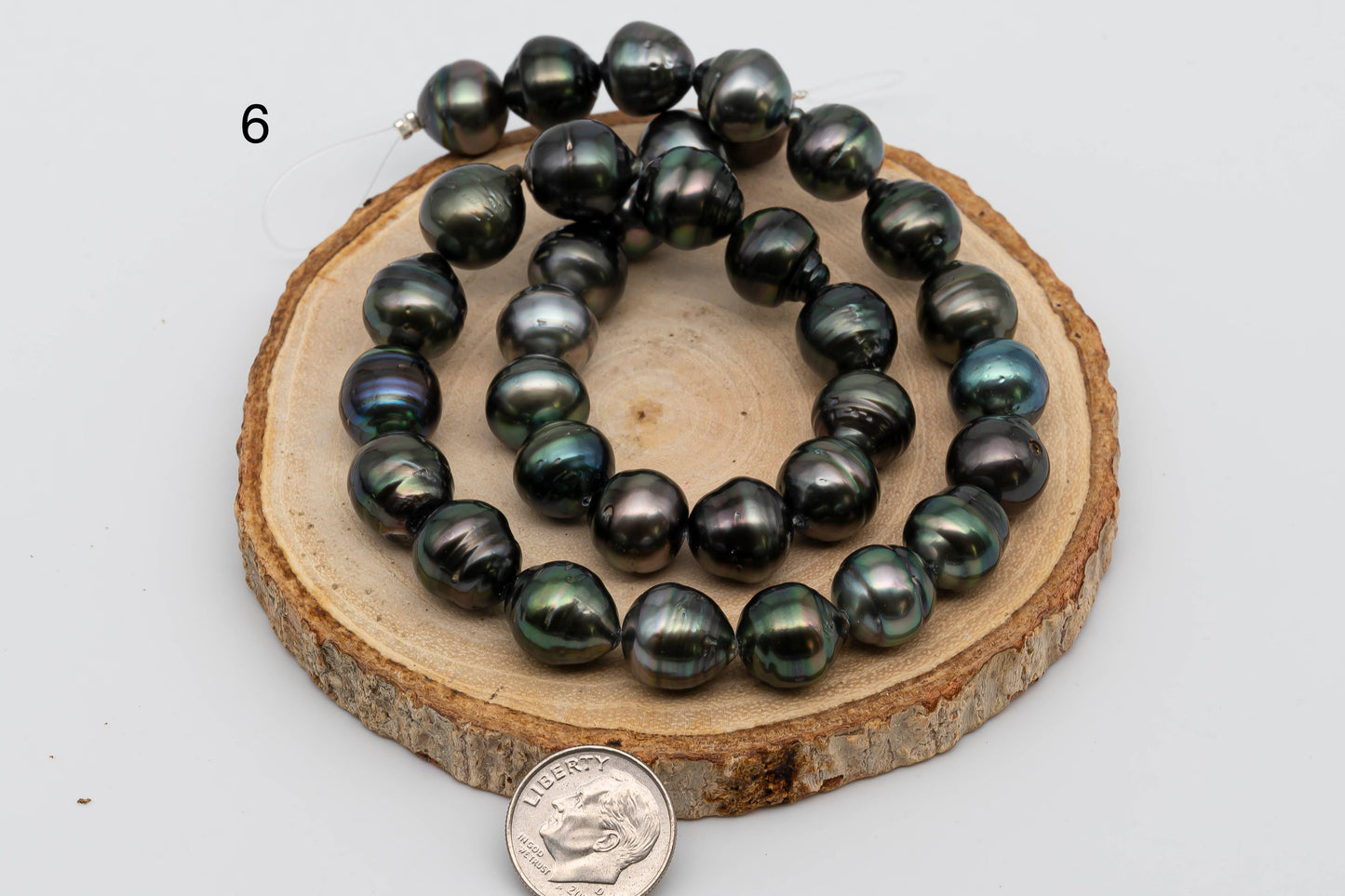 Displaying item number 6, Tahitian Pearl near round in full strand.